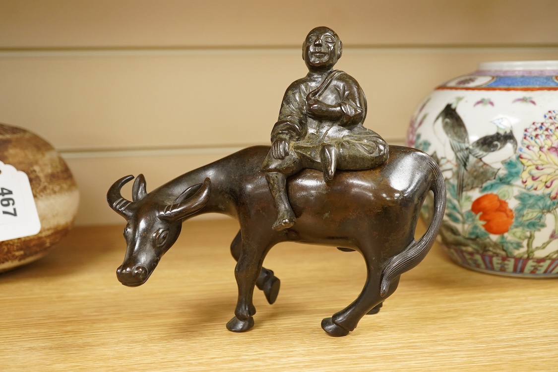 A Chinese bronze buffalo and figural incense burner, 18cm high